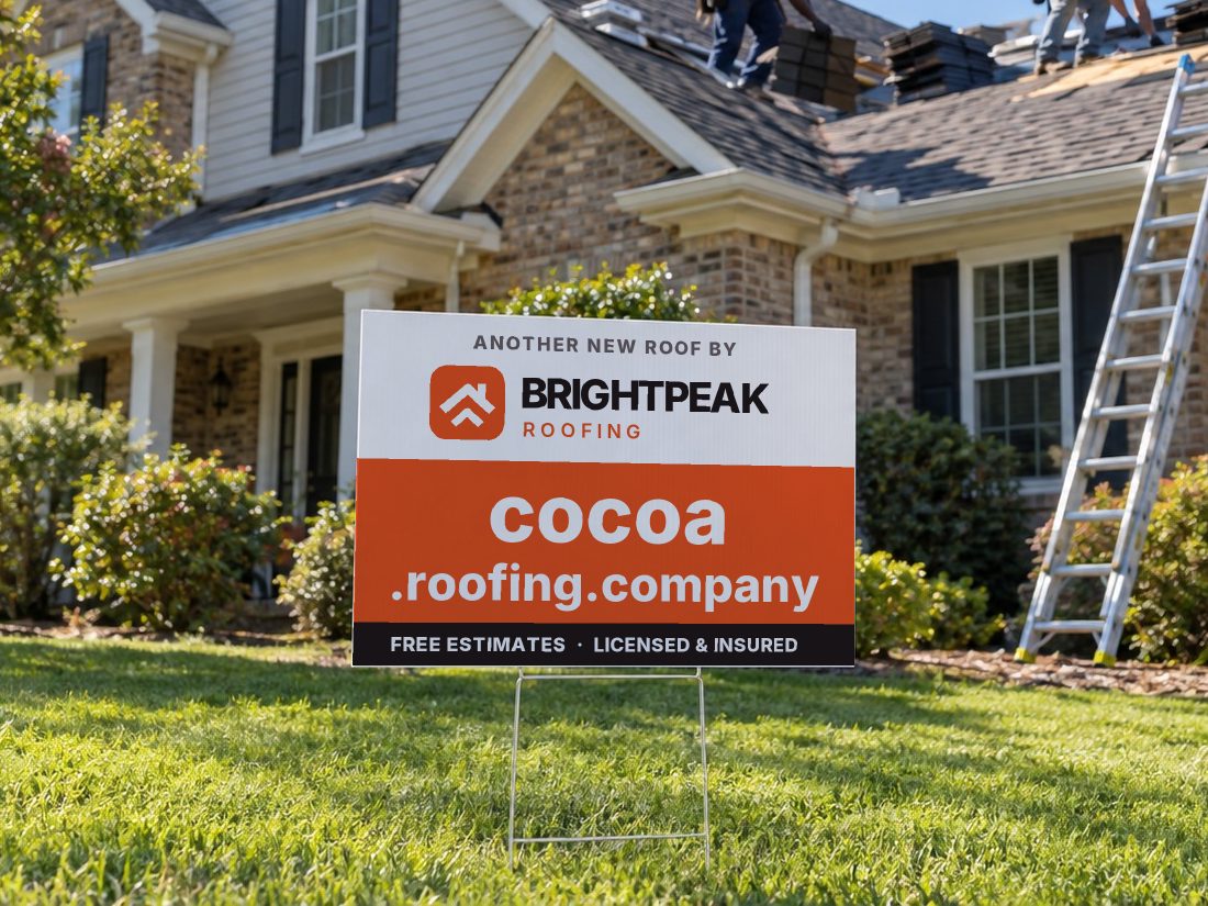 cocoa.roofing.company on a yard sign in front of a house getting a new roof